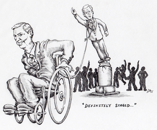 Harry Browne en fauteuil descend la statue de Bush